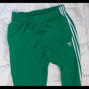 Green adidas track pants